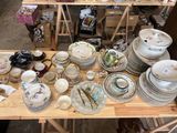 a table with many plates and bowls on it