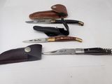 five different types of knives on a white surface