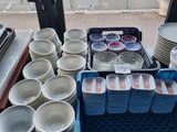 a lot of plates and bowls on the table