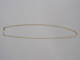 a close up of a chain on a white surface
