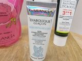 three different types of skin care products sitting on a table