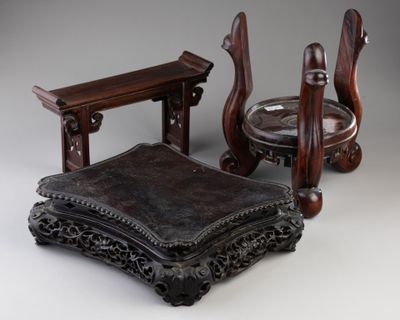 two chairs and a table that are sitting on a table