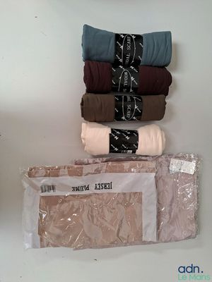 a pile of underwear sitting on top of a white table