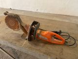 a chainsaw sitting on a table in a room