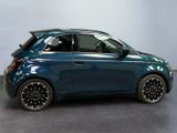 a picture of a small blue car parked in a garage