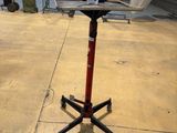 an image of a stand that has a bag on top of it