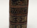 an old book that is sitting on top of a table