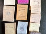 a lot of books that are stacked on top of each other
