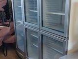 three refrigerators that are sitting next to each other