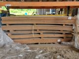 many pieces of wood stacked on top of each other