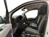the interior of a truck with the door open and the driver ' s seat down