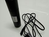 an image of a microphone and a charger on a table