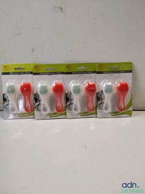 four toothbrushes in a row on top of a counter