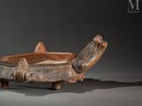 a wooden bowl that is sitting on a table
