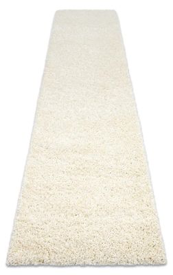 a white rug on a white floor with a white background
