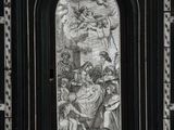 a black and white photo of a painting on the side of a building