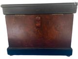 a wooden chest with a metal latch on it