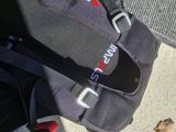 a black bag with a red handle and a black bag with a red handle and a black bag with a red handle and a black bag with a red