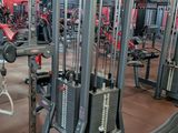 a gym with a lot of machines in the room