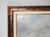 a picture of a painting on the wall of a bathroom