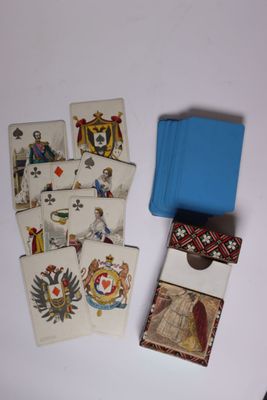 many cards and a blue case on a table