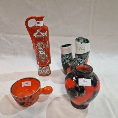three vases that are sitting on a white table