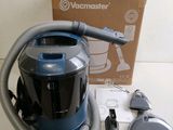 a vacuum that is sitting on a table next to a box