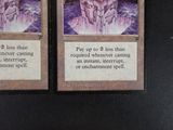 two cards that are sitting on a table