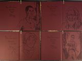 six red cards with drawings of people on them hanging on a wall