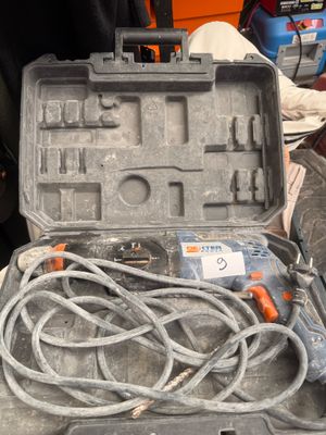 a tool in the case that is sitting on the floor