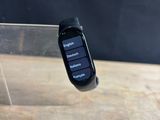 a smart watch sitting on top of a wooden table