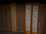 many books on a shelf in a library