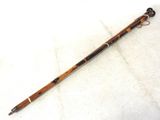 a wooden stick that is laying on the ground