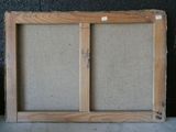 a picture of an old window frame with a cork board on it