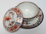 a bowl and saucer sitting on top of each other
