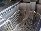 a deep fryer that is sitting on the counter