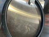 an image of a metal pan with a handle on a table