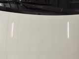 a white car that is parked in a garage