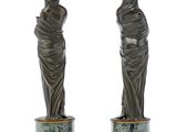 pair of antique bronze figurines of a woman and a man