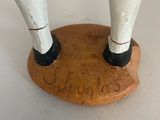 a figurine of a baseball player standing on a base