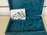 an open blue tool box with screws and nuts in it