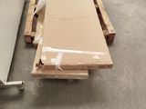 a box of cardboard sitting on a pallet in a warehouse