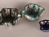 three small bowls sitting next to each other on a table
