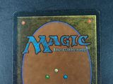 a close up of a magic the gathering card on a table