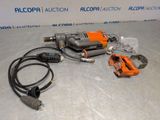 an image of a drill and other tools on a table