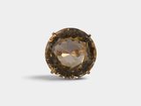 a close up of a brown diamond on a white background