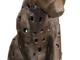 statue of a cat with holes cut out of it ' s body