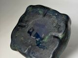 an image of a blue stone with a hole in it