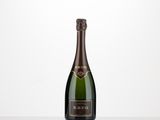 a bottle of champagne on a table with a white background