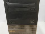 a close up of a dell desktop computer on a white surface